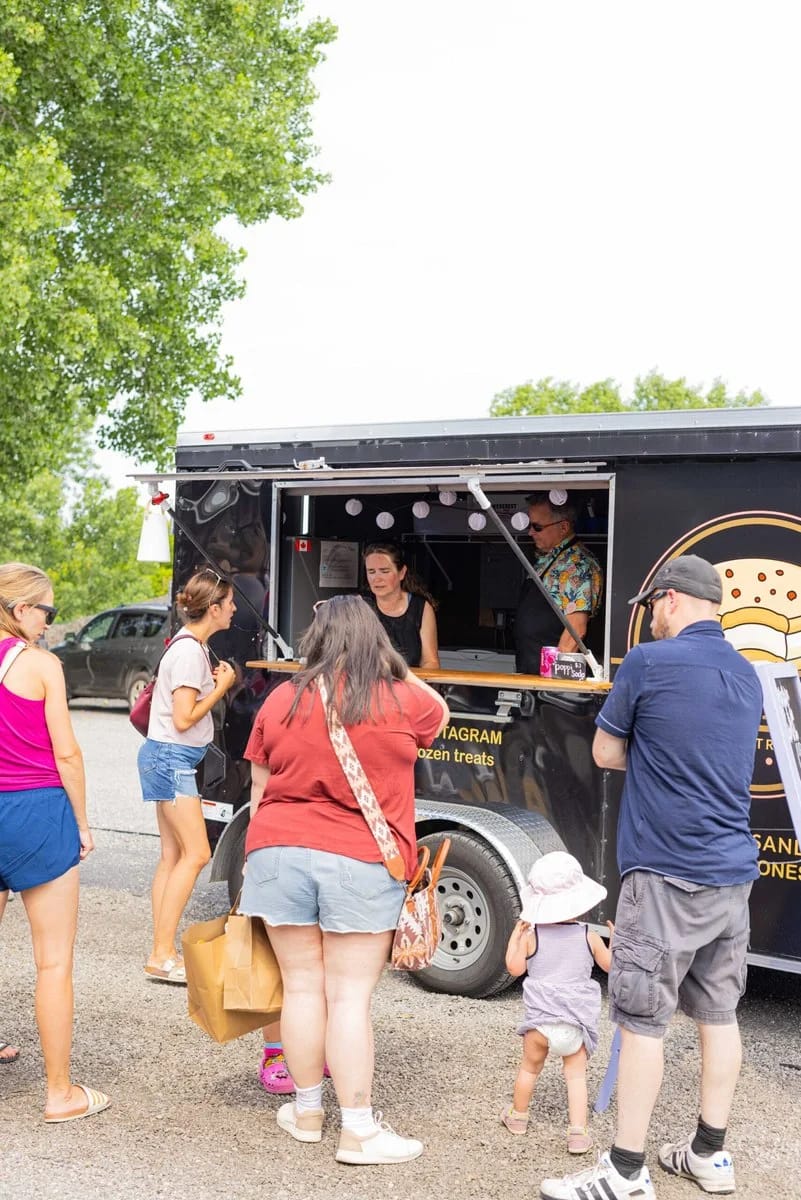 All Dae food truck serving guests — All Dae Frozen Treats