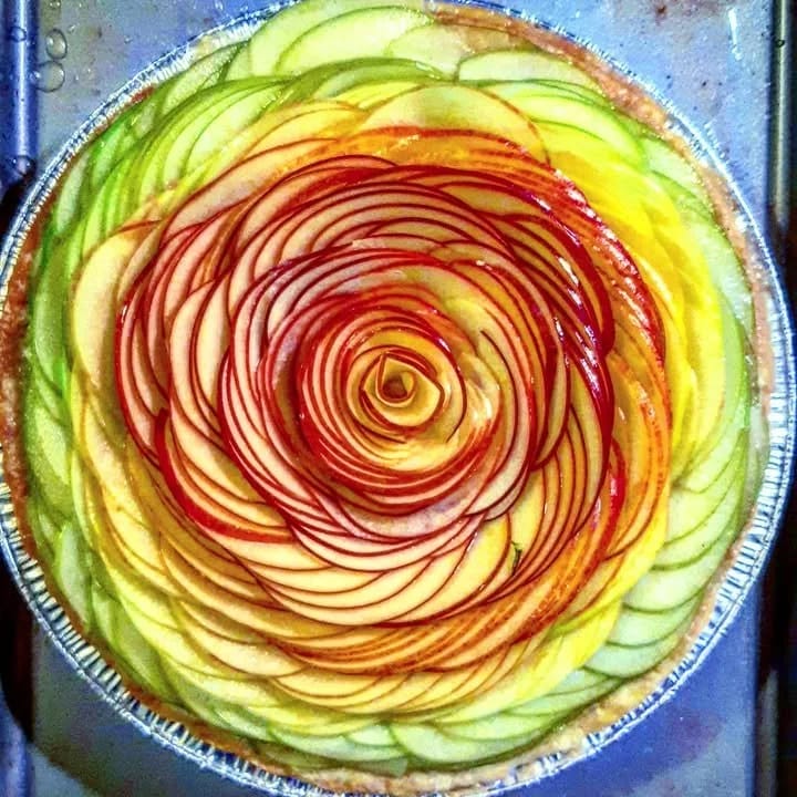 Fruit arranged in a spiral on a tart — Creative Culinary Delights by Chef Ralph