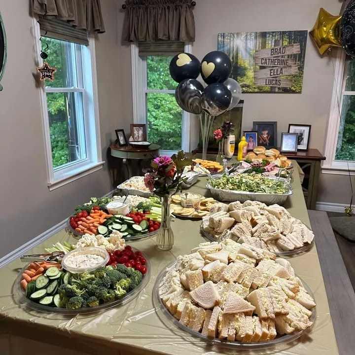 Buffet table with sandwiches and platters — Joyous Thyme Catering