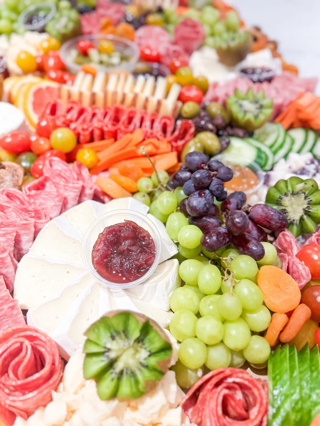 Berry & Brine charcuterie board with cheese, fruit and preserves