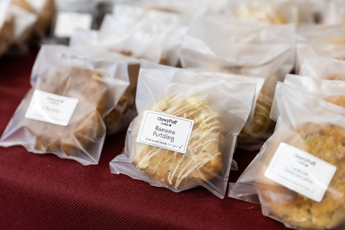 Individually wrapped ChewyPuff cookies prepared for a corporate order